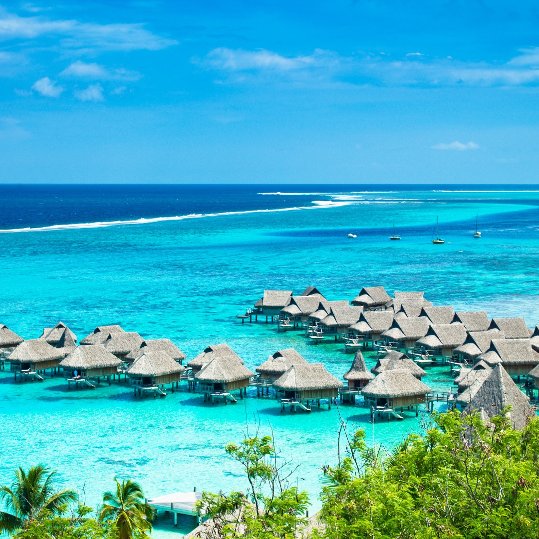 a group of huts in the water